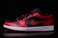 Nike Air Jordan 1 Retro Low Reverse Bred colorway sneakers on black background illustrative editorial Royalty Free Stock Photo