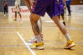 Nike yellow basketball shoes on parquet floor during basketball match