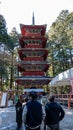 People looking at Gojunoto Five-Story Pagoda at Toshogu Shrine