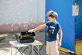 Nikolaev, Ukraine- August 15, 2020: volunteer exhibition of stray dogs. ÃÂ¡hildren play with a machine that makes soap bubbles.