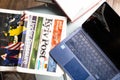 Nikolaev, Ukraine, - February, 16, 2022: glass table with Asus laptop and Kyiv Post newspaper. Businessman\'s desk. Office scenes.