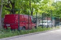 Nikolaev, Ukraine - May 31, 2020: parking fenced with metal mesh on the front lawn