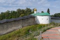 Nikolskaya tower with fortress wall of Holy Dormition Pskovo-Pechersky Monastery. Pechory, Russia Royalty Free Stock Photo