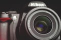 Nikon camera with af nikkor 35mm lens close-up on black background