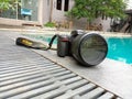 Nikon D750 camera. A swimming pool in the background.