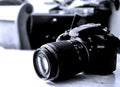 A Nikon D3200 camera on table. Royalty Free Stock Photo
