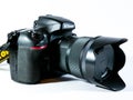 Nikon D800 Dslr photography camera with Sigma 35 mm lens on white background.