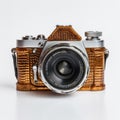 Gold Leather Camera With Crinkled Design And Monochromatic Color Scheme