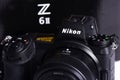 Nikon Z6 II camera photograph confrontation and competition between cameras. White background. The best mirrorless