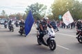 NIKOPOL, UKRAINE - 09/28/2021: Close-up of motorcyclists riding through a crowd of people. A parade on a public holiday or the