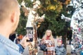 NIKOPOL, UKRAINE - 09/28/2021: Close-up of stilt walkers at the fair. Male acrobats dressed in shiny mirrored costumes. The