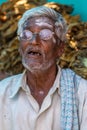 Old man with bad teeth, Nilavagilukaval Karnataka India. Royalty Free Stock Photo