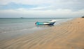 Nilaveli beach with beached fishing boat in Trincomalee Sri Lanka