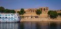 Nile Cruise Boat Next To Egyptian Temple Royalty Free Stock Photo