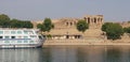 Nile Cruise Boat Next to Temple in Egypt Royalty Free Stock Photo