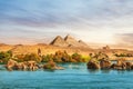 The Nile river and ancient rocks in the Aswan desert by the pyramids, Egypt Royalty Free Stock Photo