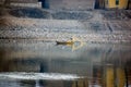 Nile River, near Aswan, Egypt. February 21, 2017: Egyptian fishermen throwing a net on the shore of the Nile river standing on a s Royalty Free Stock Photo