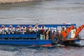 Nile River, near Aswnm, Egypt, February 21, 2017: Ferry transporting people crossing the Nile River and full of Arabian Egyptians