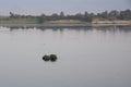 The Nile River in the vicinity of Luxor, Egypt, Africa with its crops, its boats, its towns and its cruise ships. Royalty Free Stock Photo