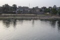 The Nile River in the vicinity of Luxor, Egypt, Africa with its crops, its boats, its towns and its cruise ships. Royalty Free Stock Photo