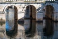 Nimes, Occitanie, France - Arched bridge at the water of the fountain gardens in old town