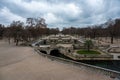 Nimes, Occitanie, France - The Fountain Gardens with trees and sculptures with pedestrians walking around Royalty Free Stock Photo