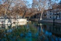 Nimes, Occitanie, France, Water ponds and monuments in roman style of the Fountain parks and garden