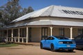 Nindigully, Queensland - October 4, 2020: Rear view of a blue 2017 Ford Mustang GT coupe parked outside the Nindigully Pub.