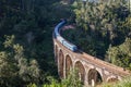 Nine Arches Bridge and blue train in Sri Lanka, Ella. Royalty Free Stock Photo