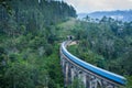 Nine Arches Bridge and blue train in Sri Lanka, Ella. Royalty Free Stock Photo