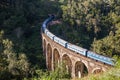 Nine Arches Bridge and blue train in Sri Lanka, Ella. Royalty Free Stock Photo