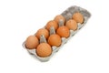 Nine brown eggs in a box isolated