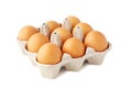 Nine brown fresh eggs in retail tray on white