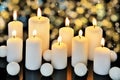 Nine burning candles on a dark shiny background