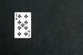 Nine of Clubs playing card on black background