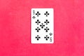 Nine of Clubs playing card on red background