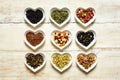 Nine colorful tea sorts in heart shaped bowls