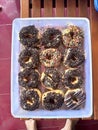 nine donuts in a plastic container Royalty Free Stock Photo