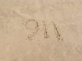 Nine eleven drawn on sand