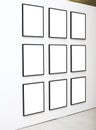 Nine empty frames on white wall exhibition Royalty Free Stock Photo