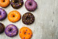 nine halloween donuts on a table with wood texture tiled with Copy space