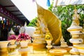 Nine headed great naga sculpture with golden Buddha statue at wat Rai-Khing Temple, Thailand. Royalty Free Stock Photo