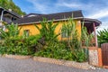 Nine Mile, Jamaica JANUARY 07, 2017: Yellow house on the hillside, just outside the Bob Marley Mausoleum compound. Building is