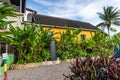 Nine Mile, Jamaica JANUARY 07, 2017: just outside the Bob Marley Mausoleum compound: yellow house on the hillside