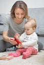 Nine months old baby girl playing with her mother Royalty Free Stock Photo