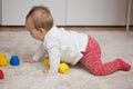 Nine months old baby girl playing with her toys Royalty Free Stock Photo