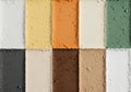 Nine rectangular blocks of various pastel-colored chalk powders Royalty Free Stock Photo
