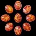 Nine Red Easter Eggs Onion Skin Dyed And Decorated With Weed Leaves Imprints Isolated On Black Background