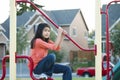 Nine year old girl playing at playground