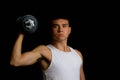 Nineteen year old teen boy exercising with a dumbbell Royalty Free Stock Photo